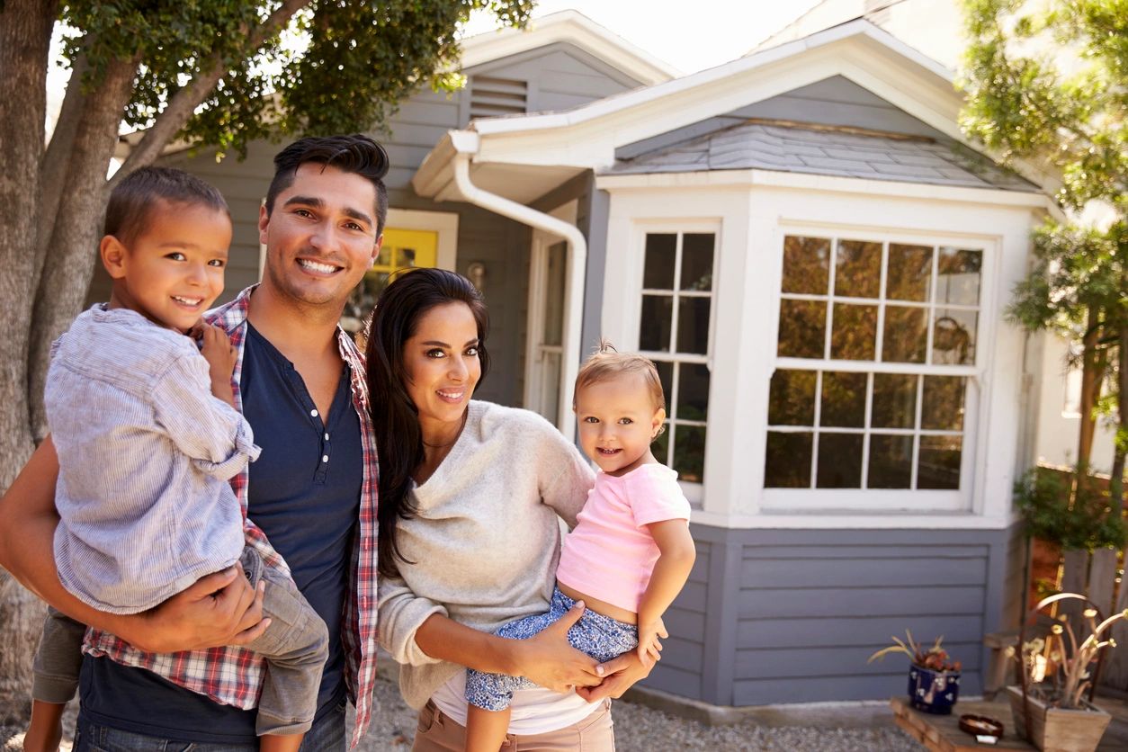 family standing near house